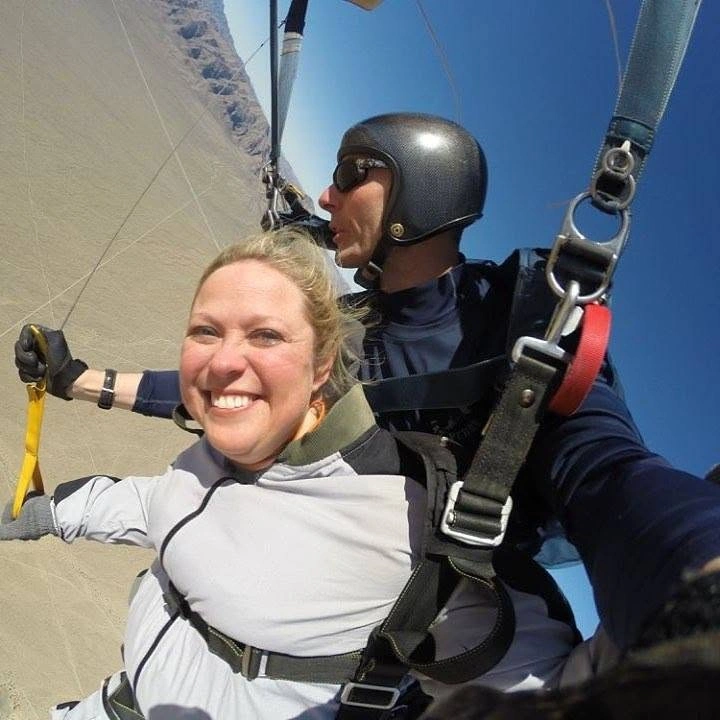 Woman parachuting safely