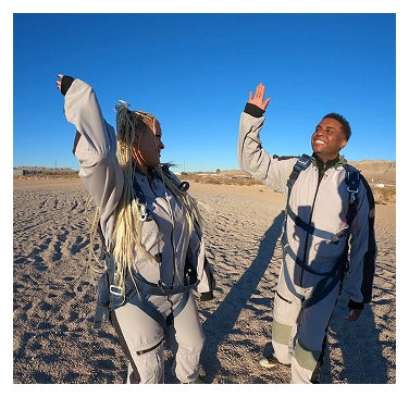Skydivers celebrating together
